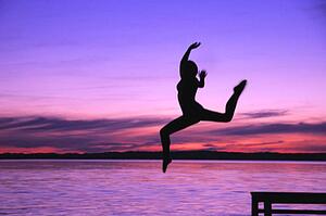 Woman leaps into the water