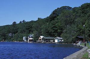 A body of water with cottages lining it