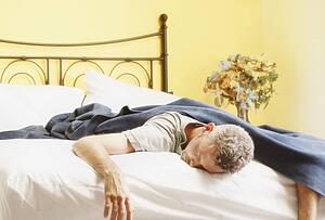 Man sleeping in bed