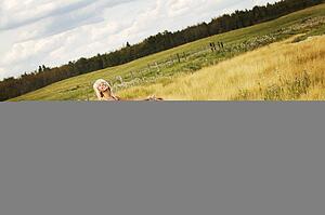 Teen girl walking through field