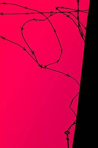 A mangled barb wire fence