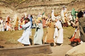 Crowd marching and dancing