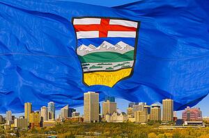Alberta's flag behind Edmonton Skyline