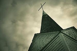 A cross on a steeple of a church