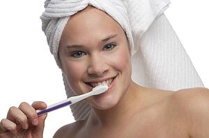 Woman brushing teeth