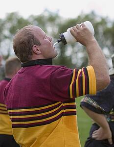 Rugby player drinking water