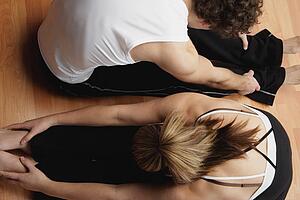 Couple stretching together