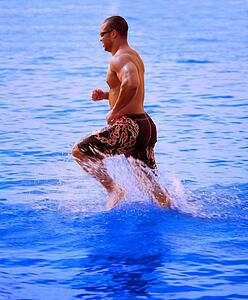 Man running in lake