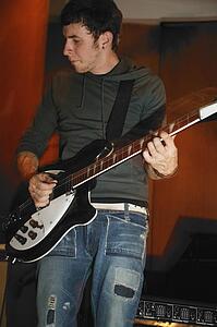 Man plays his electric guitar