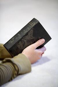 Teen holding Bible