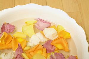 A bowl with water and flower petals