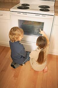 Children watching the oven