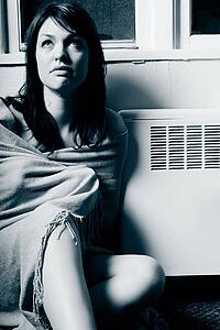 Sitting by a heating vent