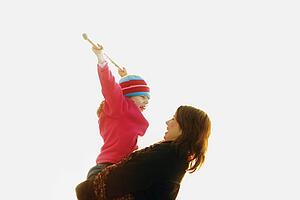 Mother holds child in her arms