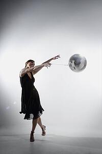 Woman dancing with disco ball