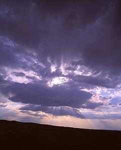 Sun rays shining through clouds