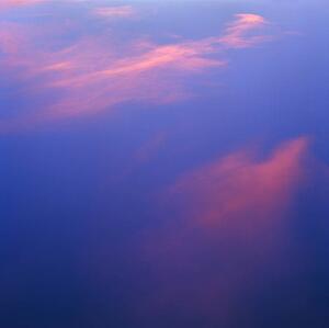 Pink clouds in a blue sky