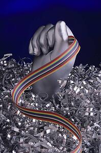 Silver hand holding computer cable