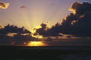 Sunrise through dark clouds, Sand Beach Park