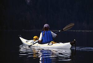 Kayaker and reflection.