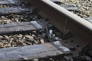 Close up of an older train track in the spring