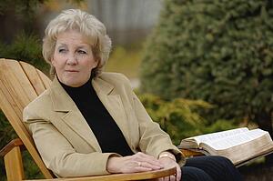 Woman looking off during devotions