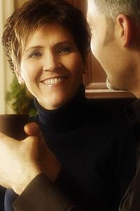Man and woman conversing over coffee