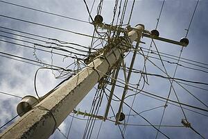Wires clustered around pole