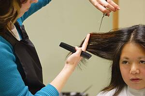 Woman getting a haircut