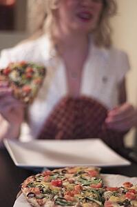 Woman eating pizza