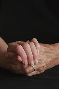 Senior couple holding hands