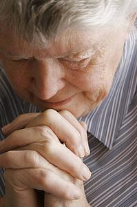 Senior woman praying