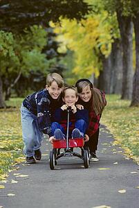 Children playing with wagon