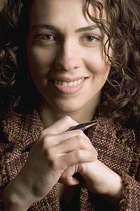 Smiling woman with pen