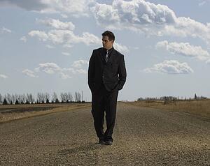 Businessman walking on road