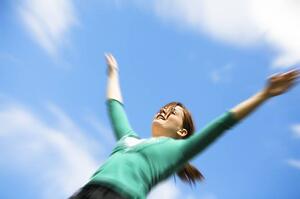 Girl with arms raised