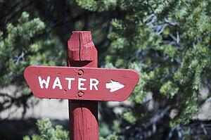 Sign pointing toward water
