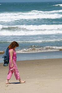 Woman walking on beach