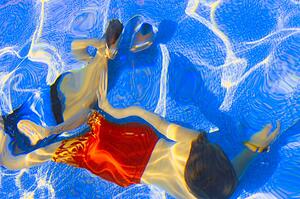 Kids swimming underwater