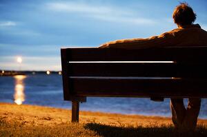 Single man watching sunset