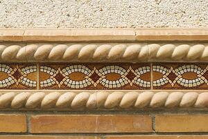 Decorative border tile on outside wall