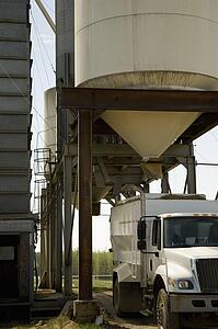 Silage containers above truck