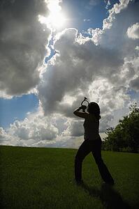 Woman playing horn