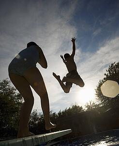 Launching into the air from a diving board
