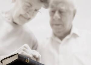 Senior couple praying