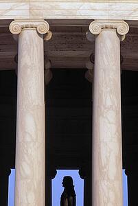 Columns with the silhouette of the Jefferson statue