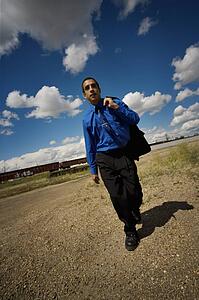 Man walking near railroad tracks