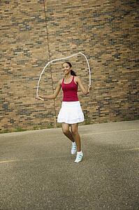 Young woman skipping