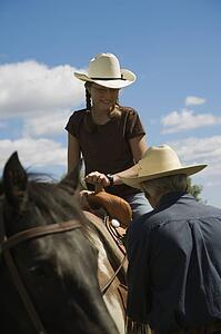 Girl on horseback with grandfather