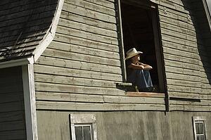 Young woman in barn loft